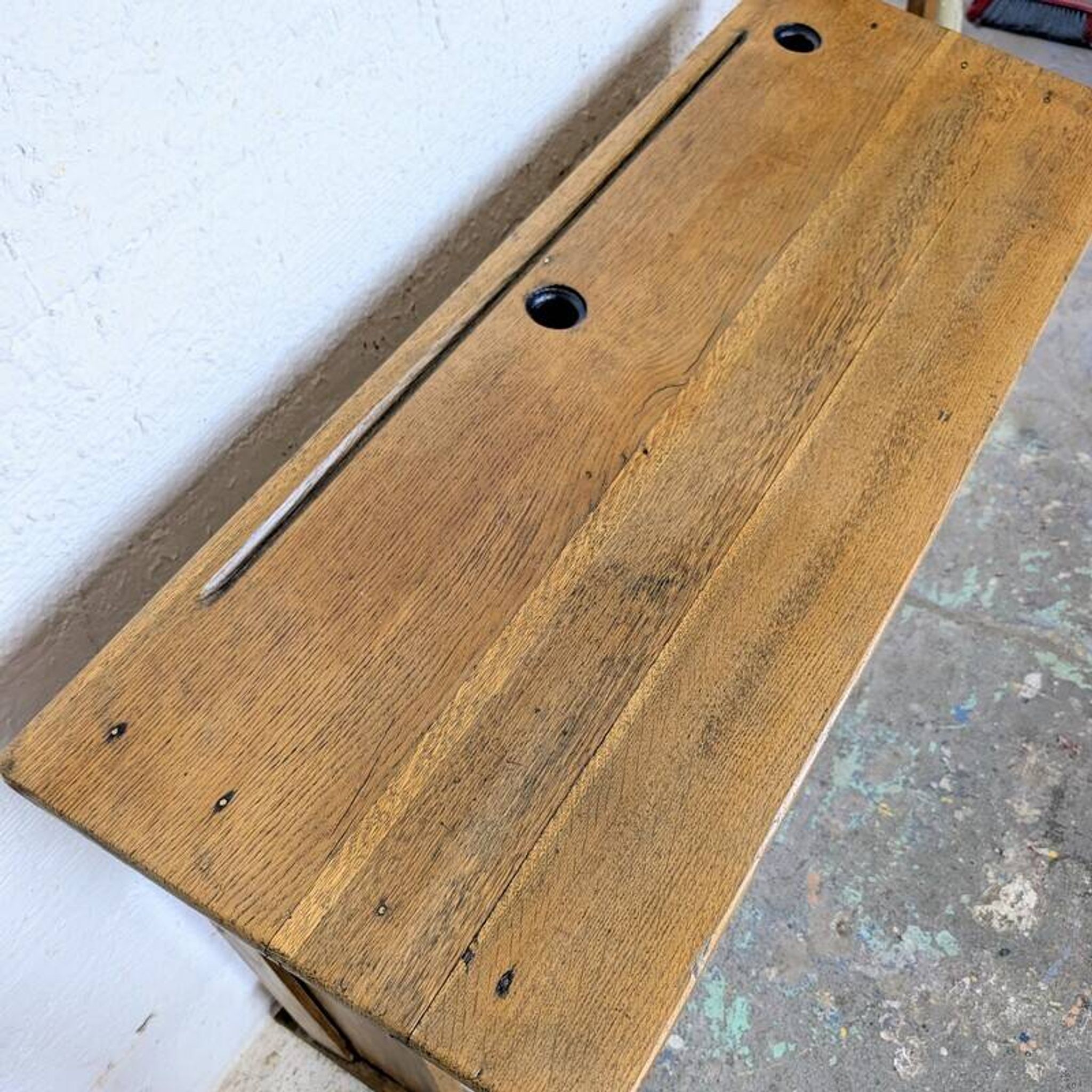 Double school desk and its wooden bench