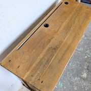 Double school desk and its wooden bench
