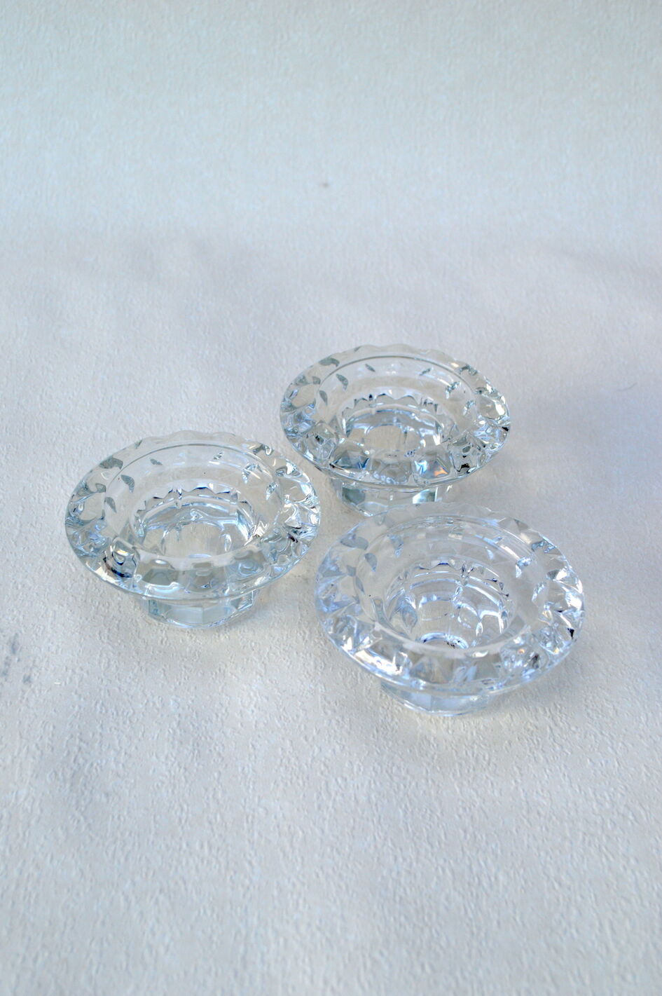 Trio of carved glass candle holders