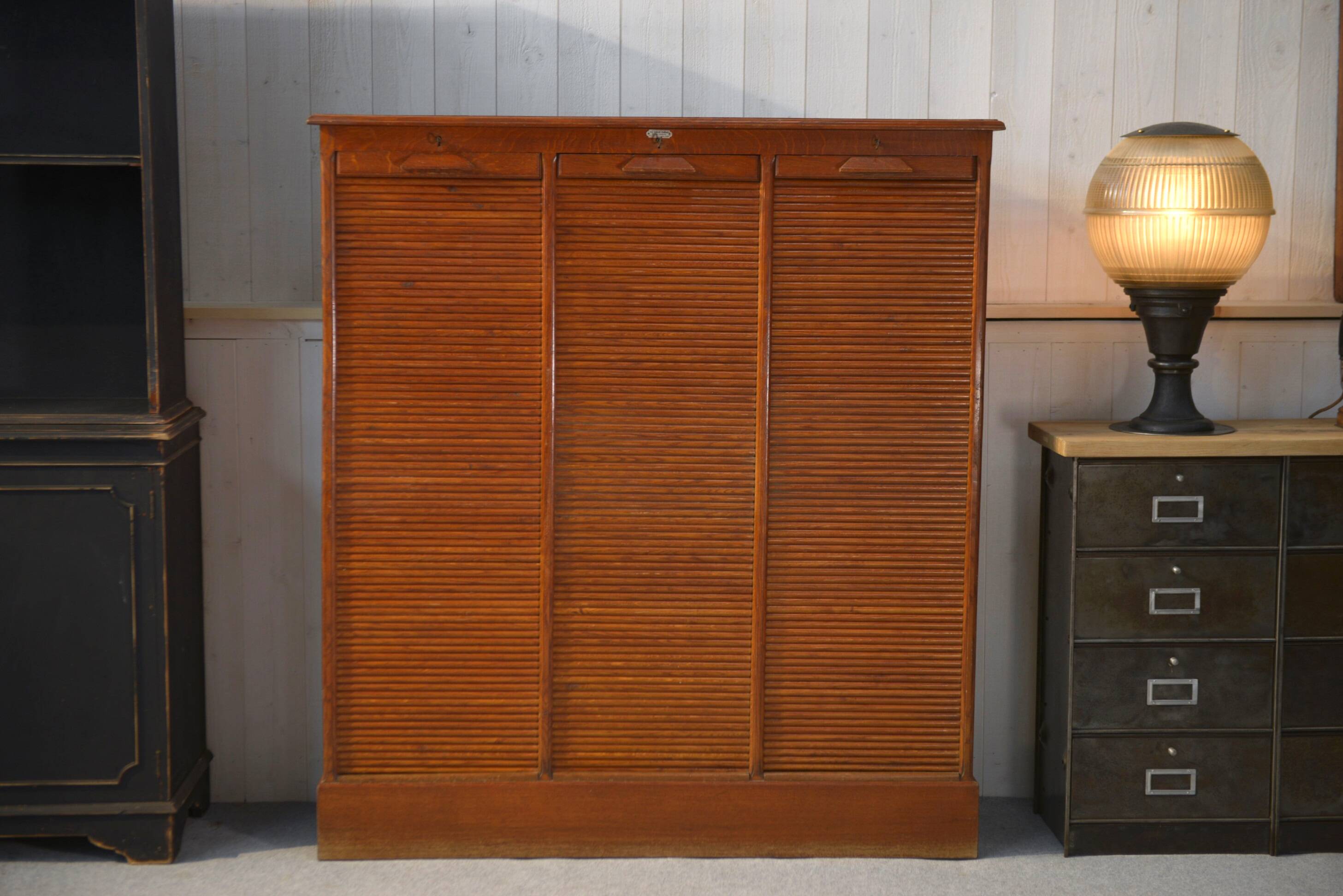 Wooden notary cabinet with shutter from the brand "Au vieux chêne" 1950's