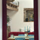 Large antique moulded mirror in wine red / plum (101 x 74 cm)