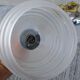 Pair of frosted glass wall lights with brass attachments, circa 1970