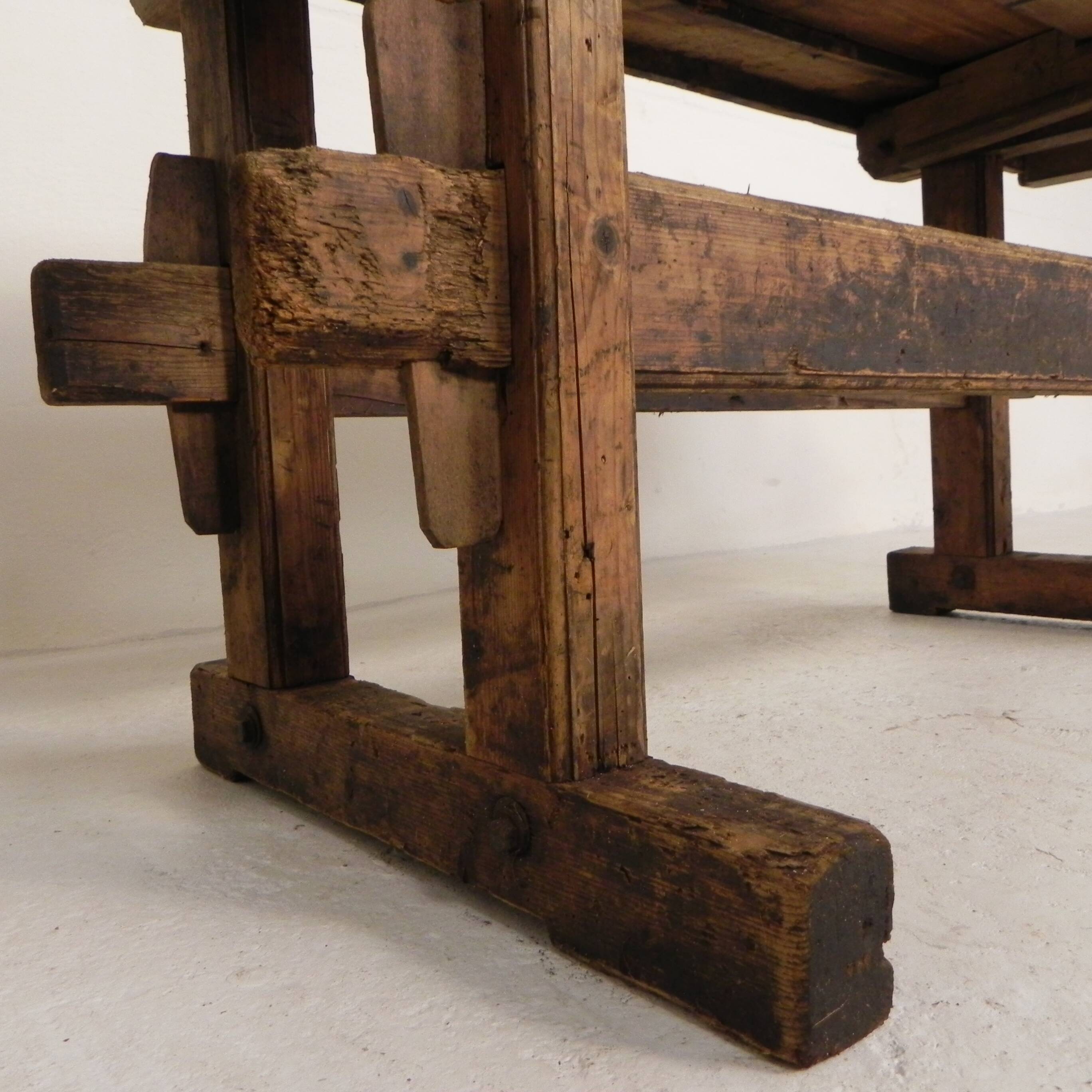 Wooden industrial workbench with vice, 194 cm long, 1930s.