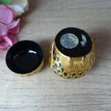 Old small black and gold lacquered wooden box in the shape of an owl