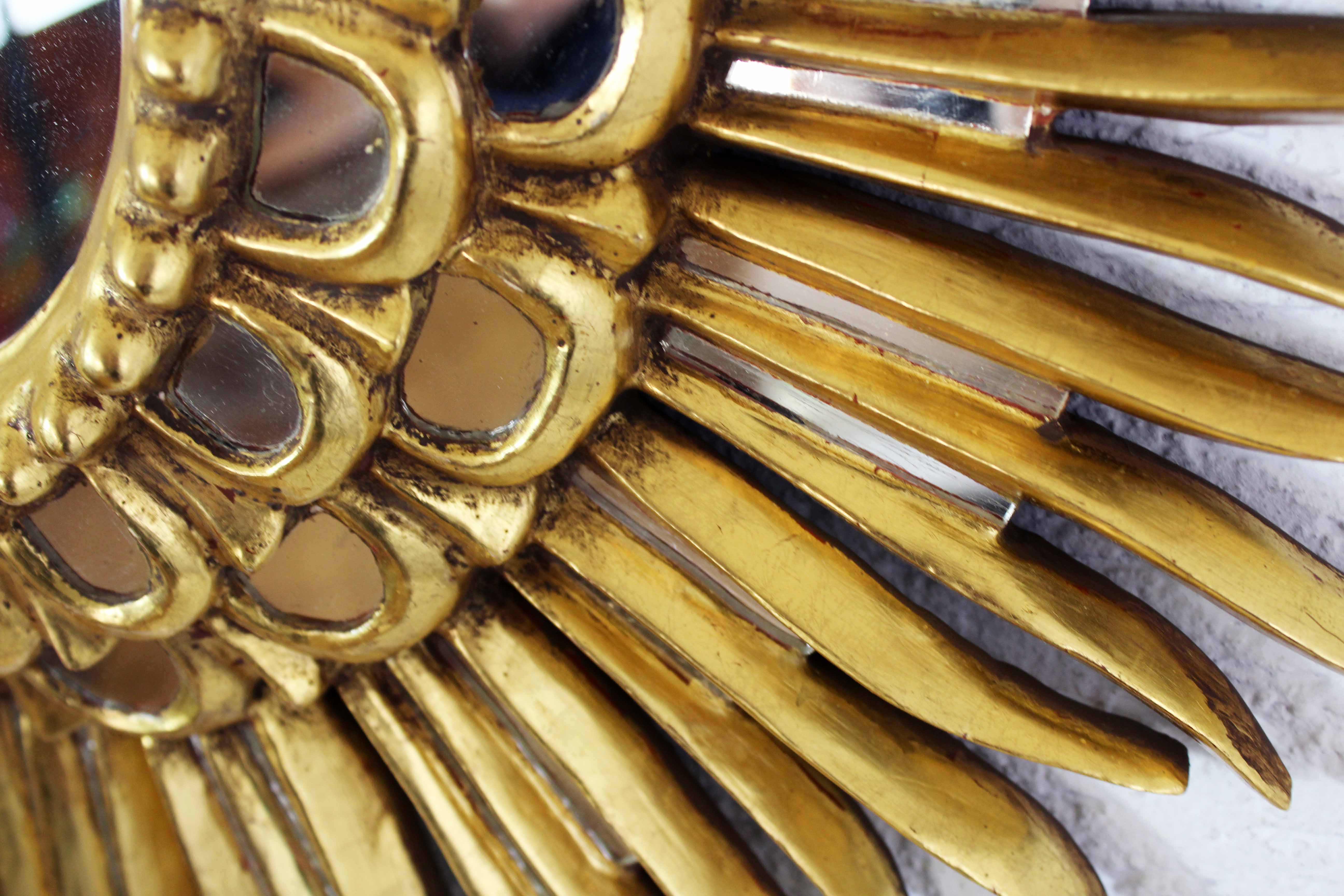 Sun mirror in wood and gilded stucco