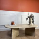 Oval coffee table in raw travertine