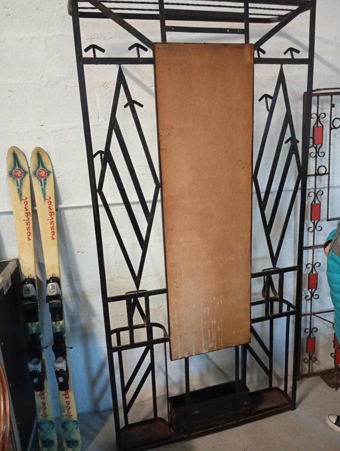 Exceptional and imposing hall wardrobe in hammered wrought iron.