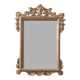 Mirror with a carved wooden frame in an antique style in pure gold.