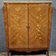 Curved Louis XV style armoire with floral marquetry, 20th century period.