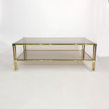 Table basse à deux niveaux en laiton Hollywood Regency Verre fumé en or des années 1970