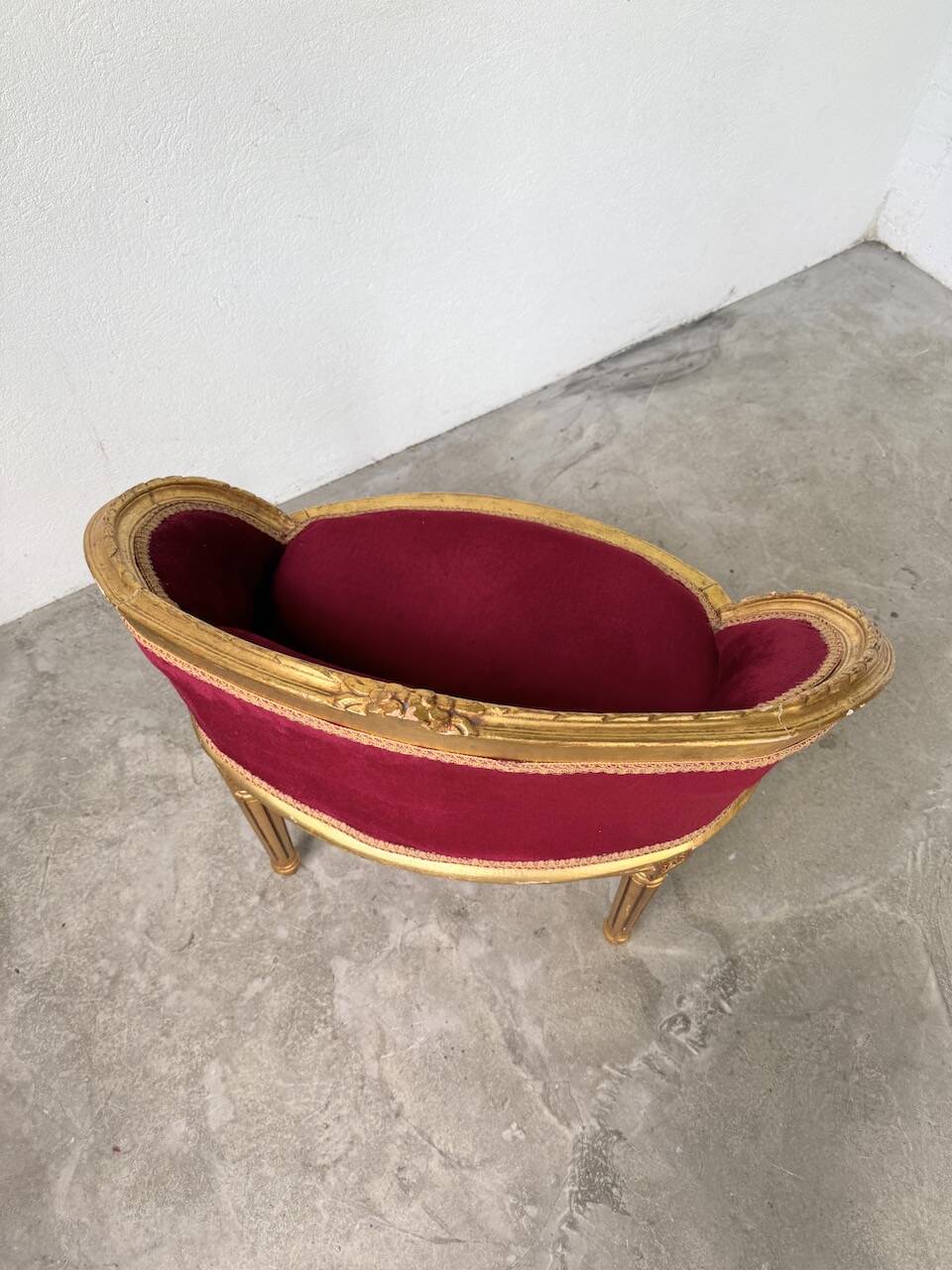 Louis XVI gilt wood and red velvet armchair