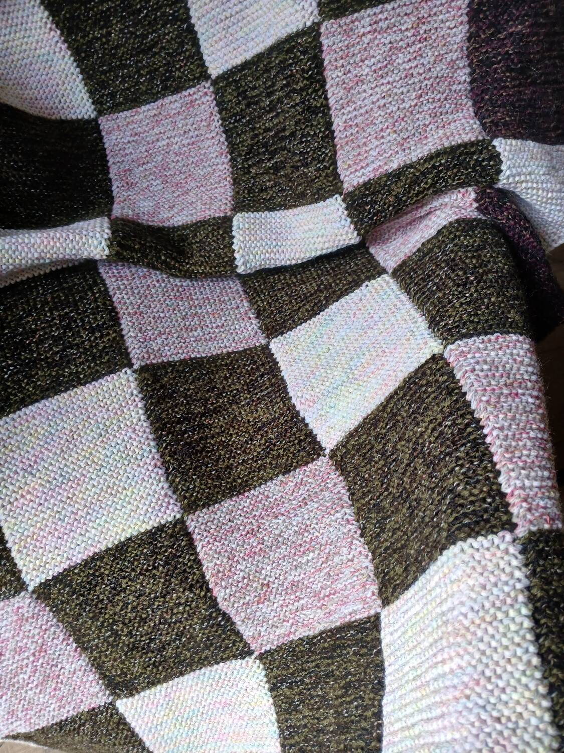 Hand-knitted patchwork plaid