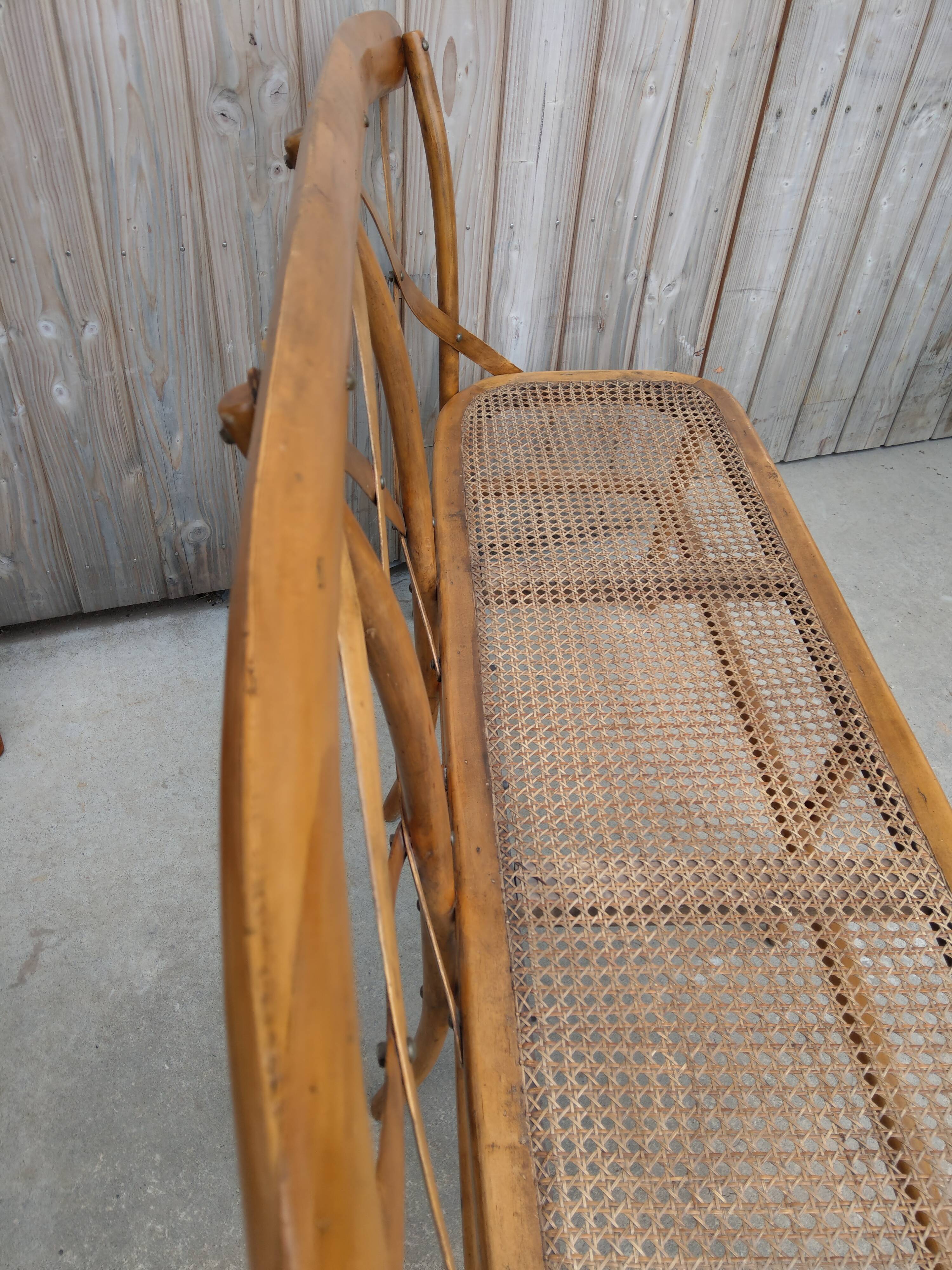 Former bench in wood and caning