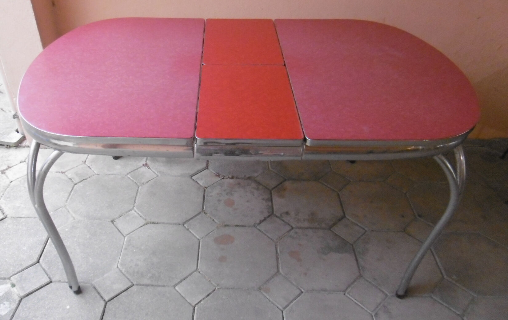 Vintage table of the 60s in red formica and chrome legs