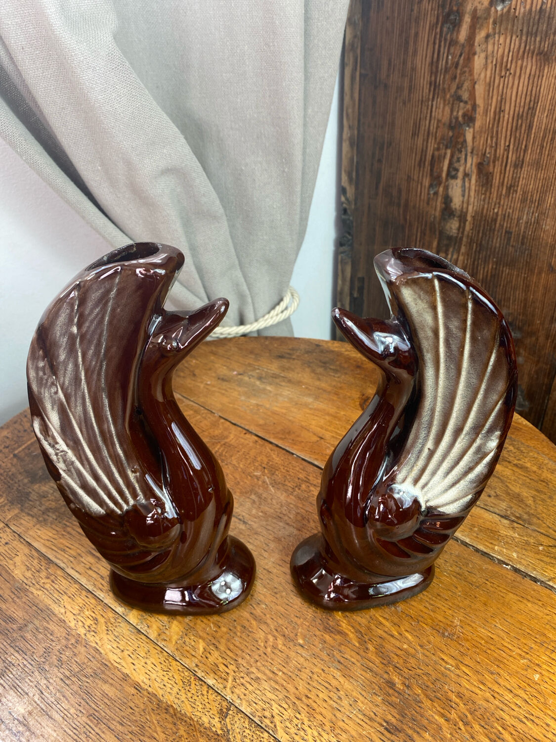 Pair of ceramic vases in the shape of swans.