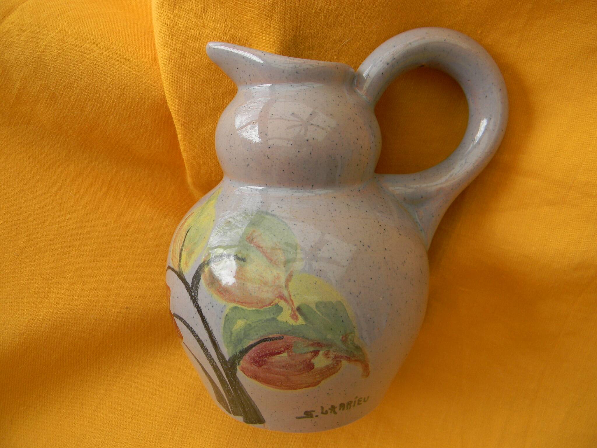 Ceramic pitcher by simone larrieu.