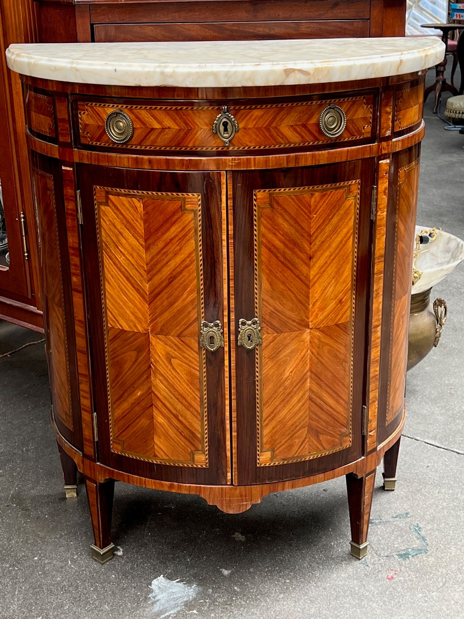 Louis XVI style chest of drawers with marquetry and marble top.