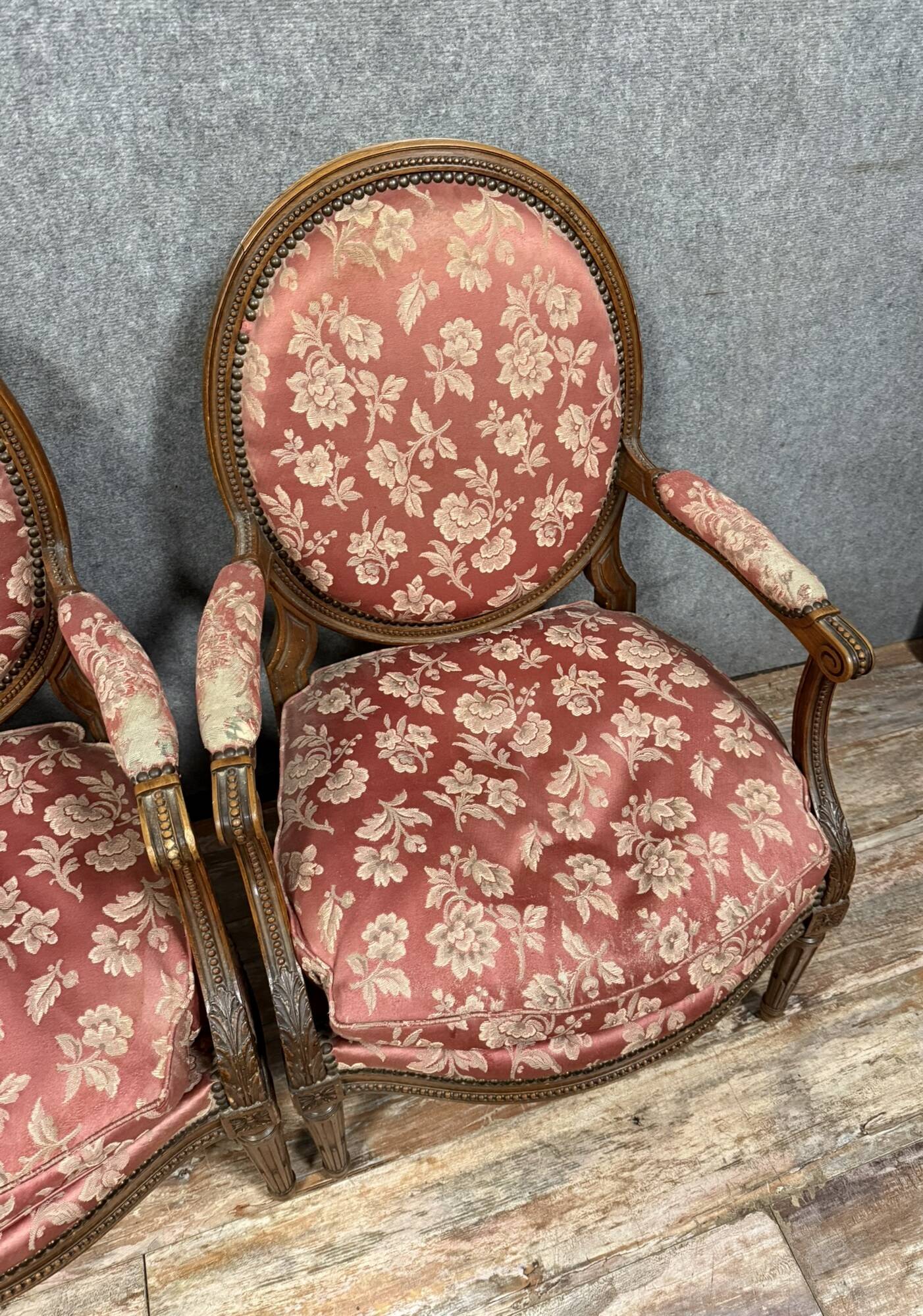 Pair of Louis XVI style armchairs in carved wood circa 1850