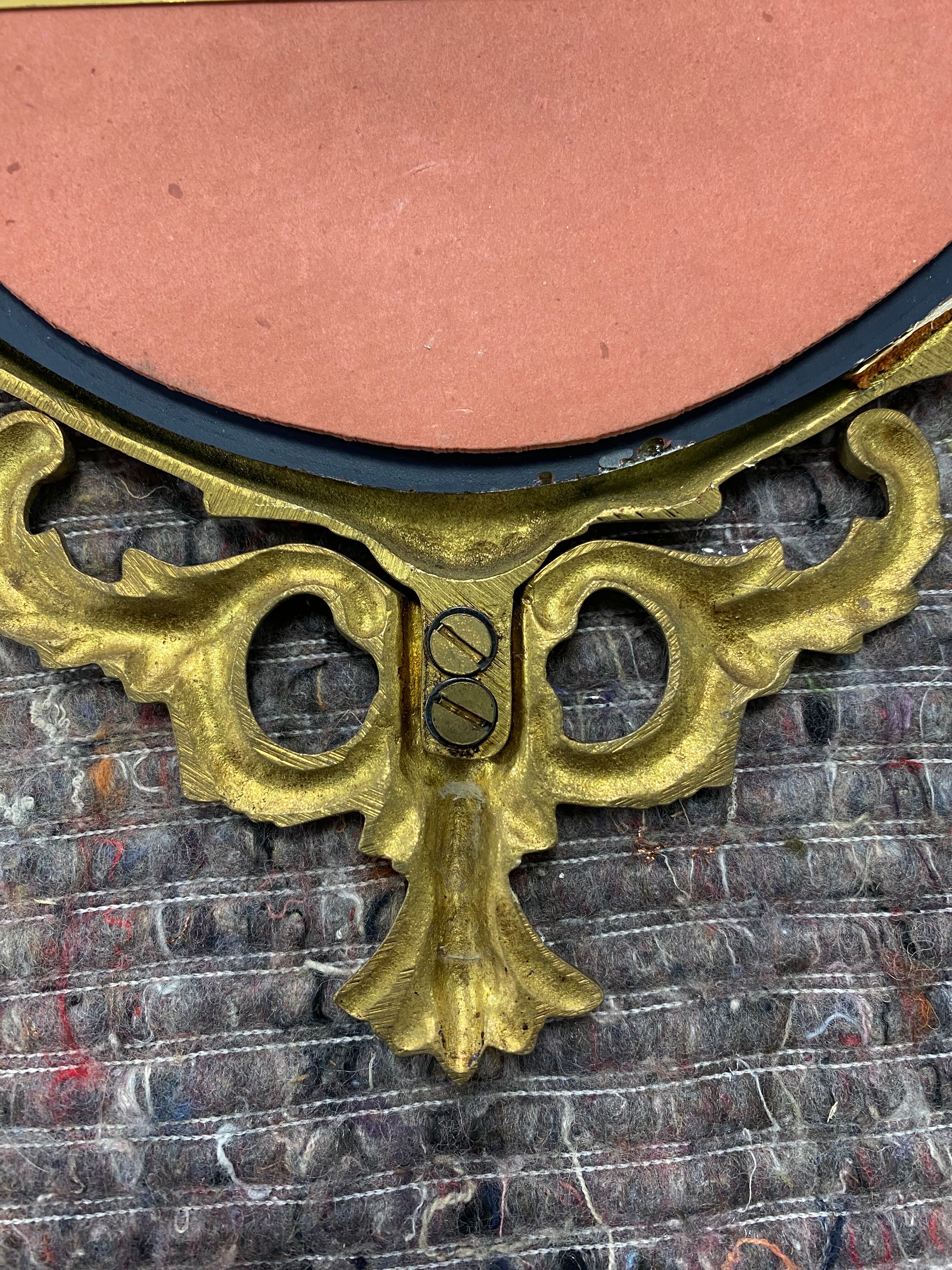 Oval gilded mirror