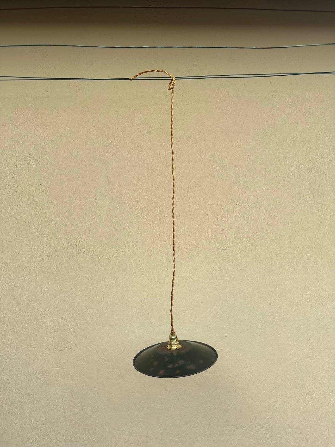 Old industrial black and white vintage enameled sheet metal pendant light