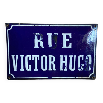 Old enamelled street sign "Rue Victor Hugo" blue and white