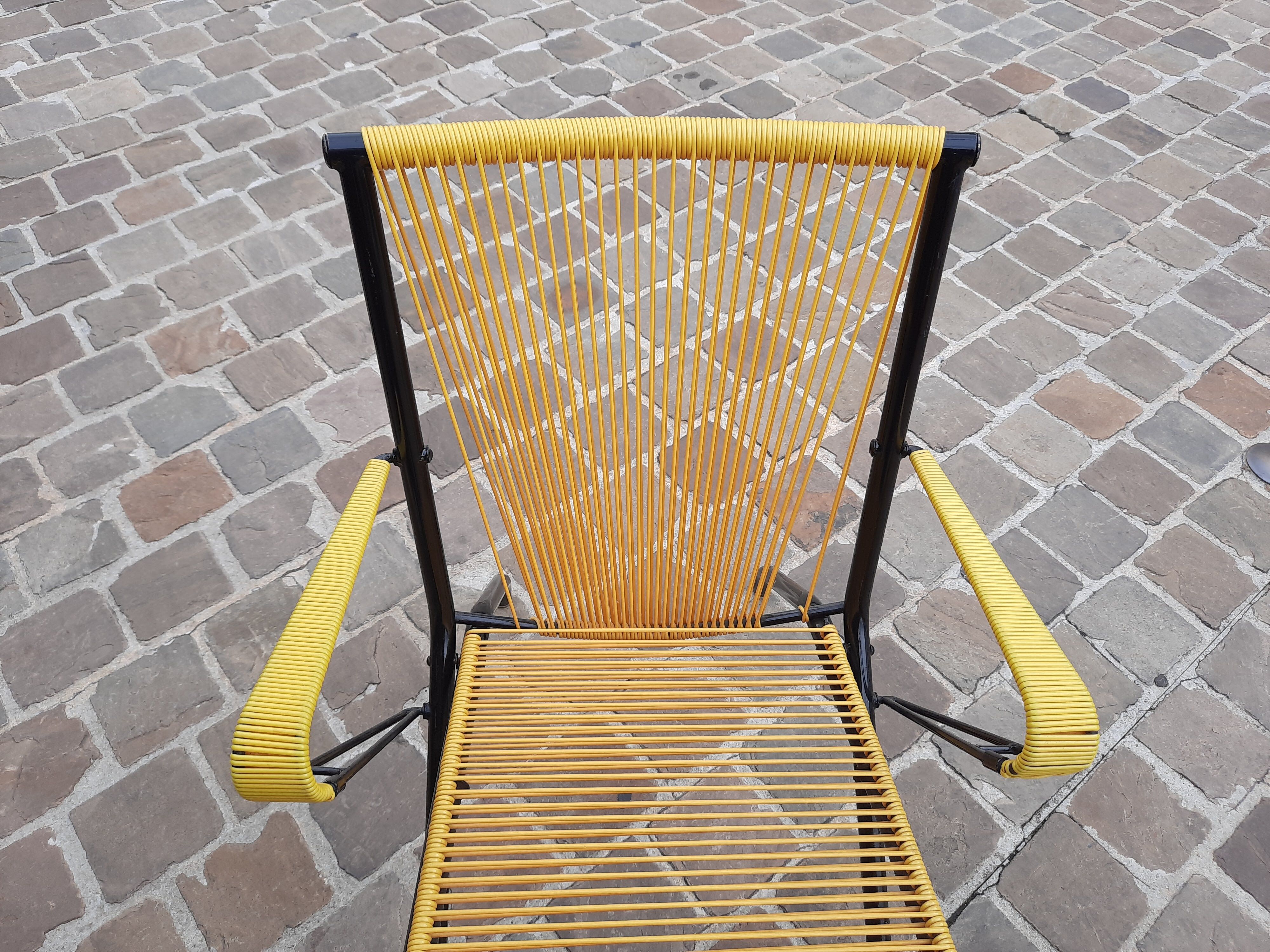 Folding chair in red scoubidou and black metal structure