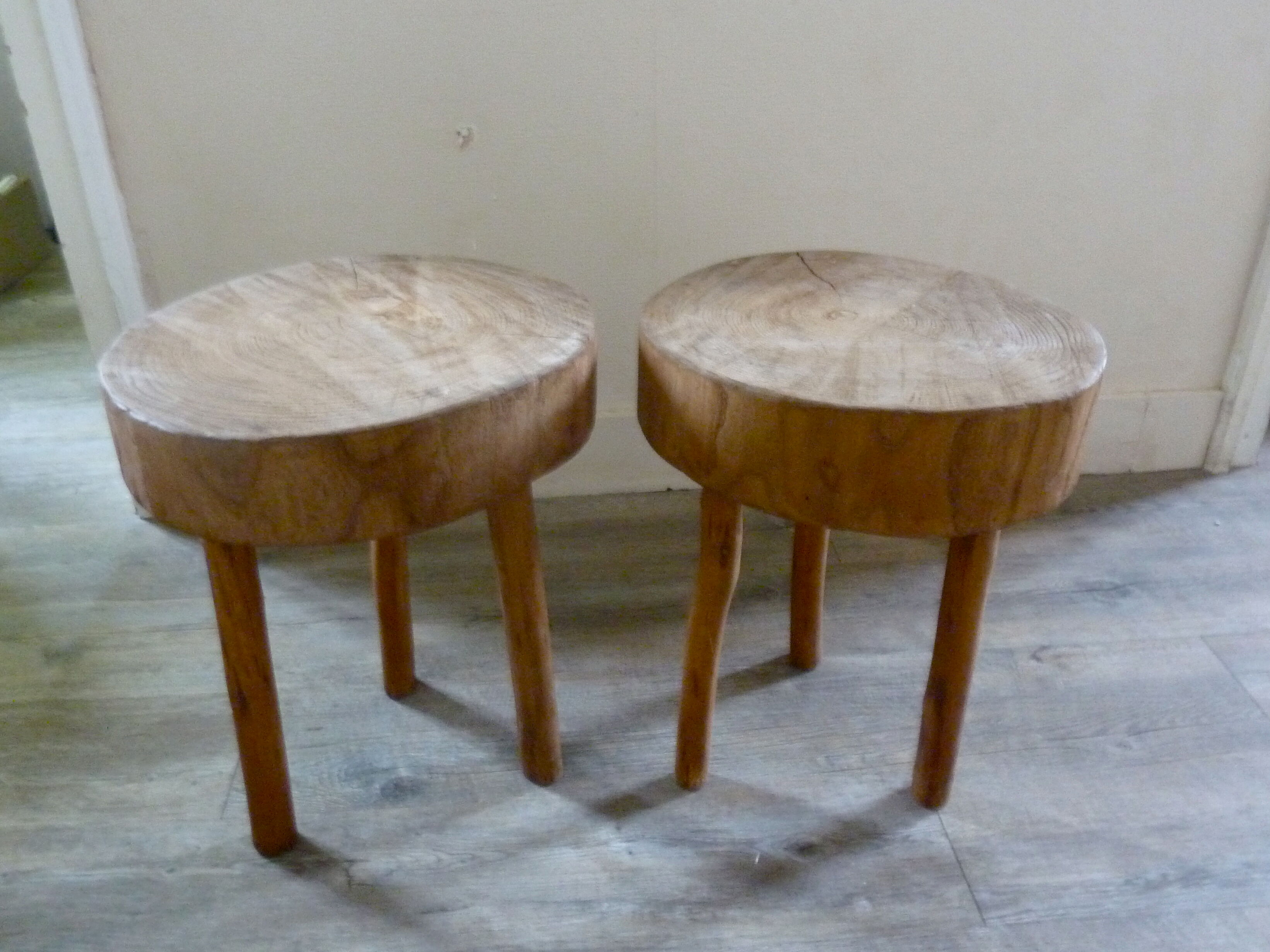 Pair of stools of tripod v with raw wood seat