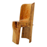Brutalist sculptural chair in solid oak in wabi-sabi style.