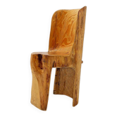 Brutalist sculptural chair in solid oak in wabi-sabi style.