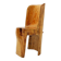 Brutalist sculptural chair in solid oak in wabi-sabi style.