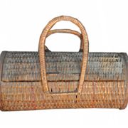 Vintage brown wicker cylindrical basket from the 1940s — long case for a bottle
