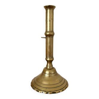 Golden brass push candle holder