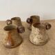 4 pyrite stoneware cups attributed to Jean-Pierre Prudhomme. 1960s.