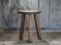 Vintage stool, wooden stool, tripod stool, trilobite stool, door.