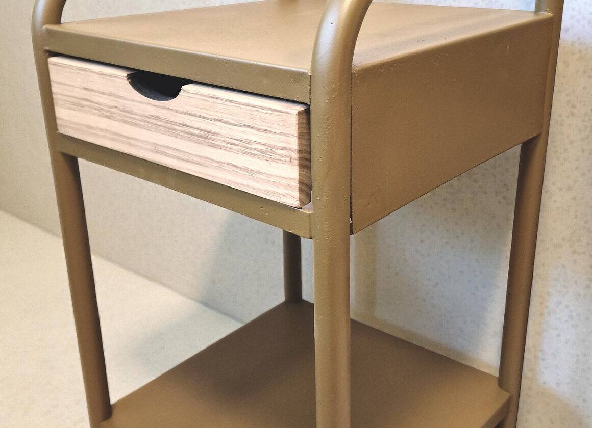 Old ochre metal bedside tables from a boarding school.