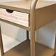 Old ochre metal bedside tables from a boarding school.