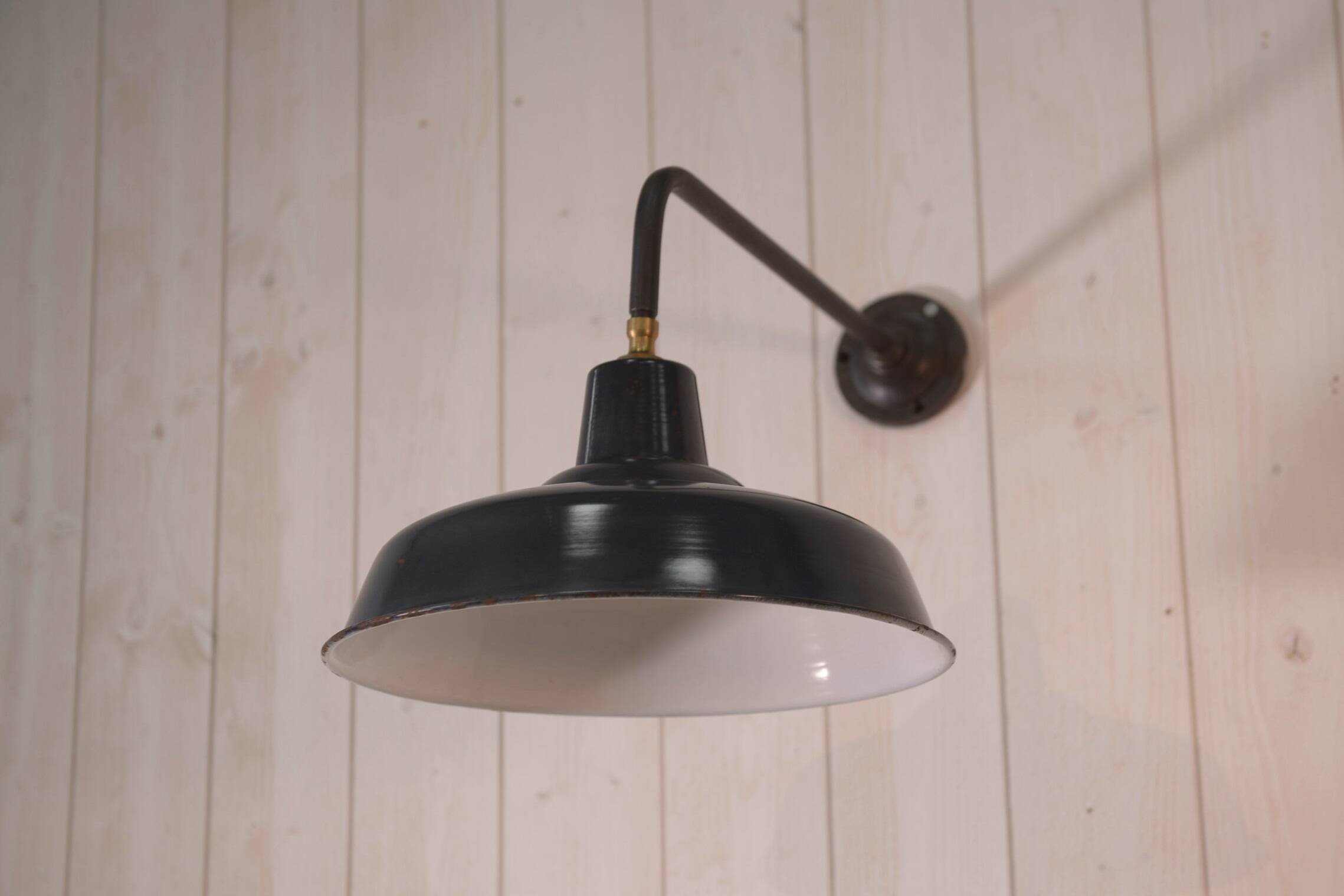 Antique cast iron wall bracket and enamelled globe, 1950s
