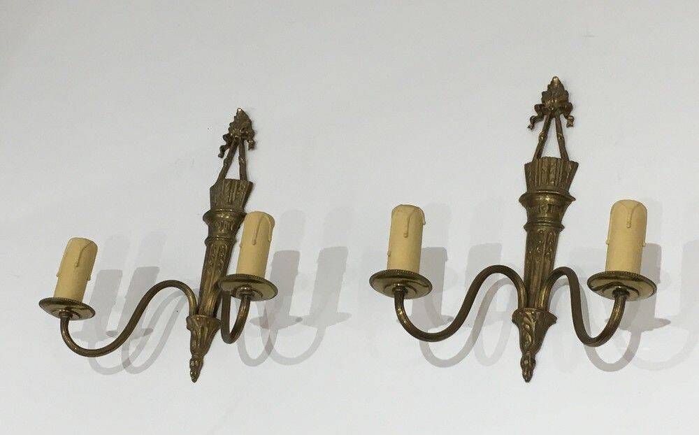 Pair of Louis XVI style bronze wall sconces with quivers and ribbons