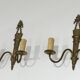 Pair of Louis XVI style bronze wall sconces with quivers and ribbons