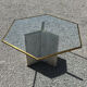 Dining table in travertine, glass top and brass (c.1980)