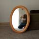 Vintage oval mirror in beech from the 70s/80s.