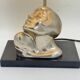 Vintage Art Deco style table lamp, face sculpture, silver-toned bust.