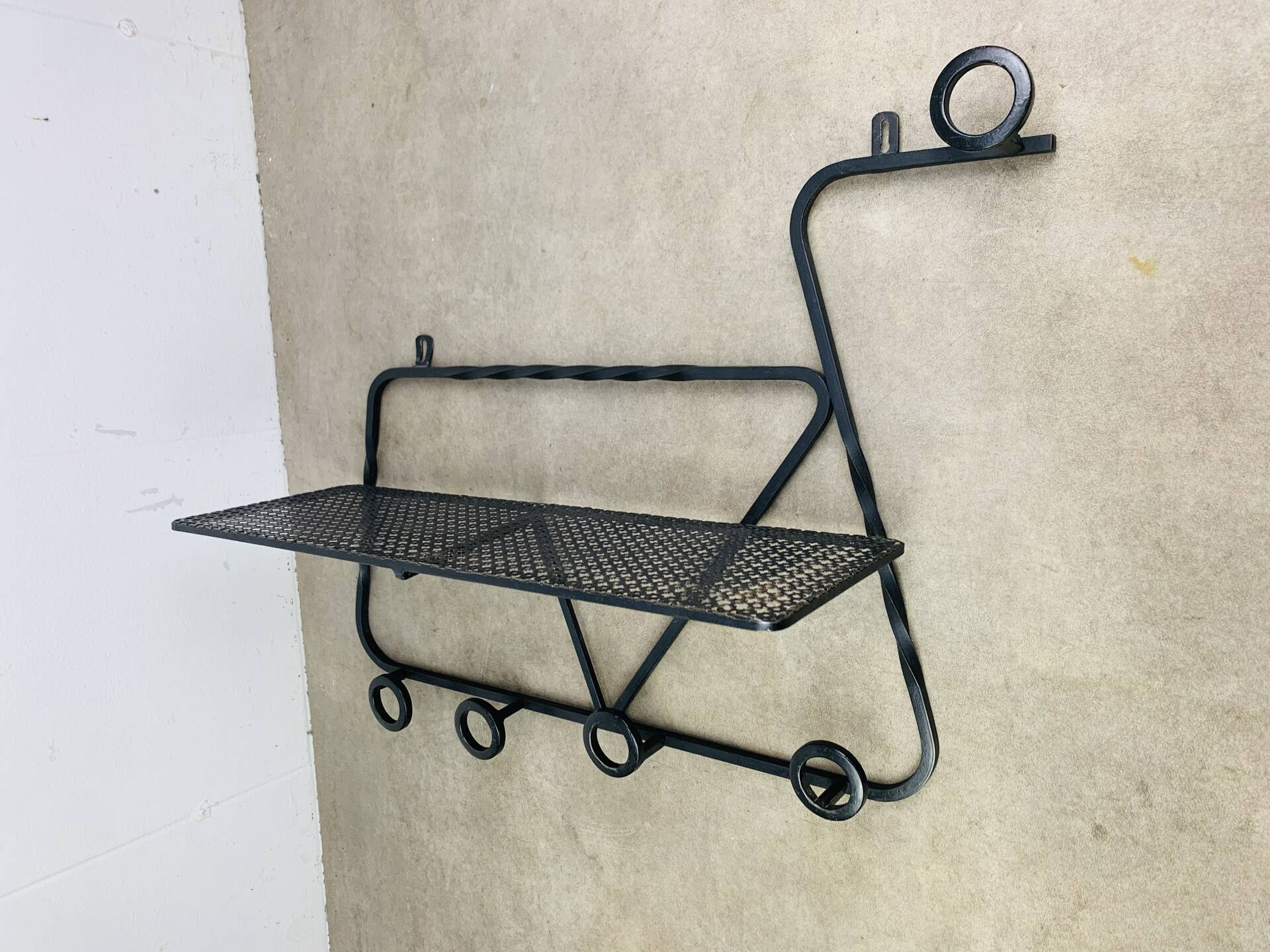 Wall-mounted coat rack/wardrobe from the 1950s, wrought iron and rigidule.