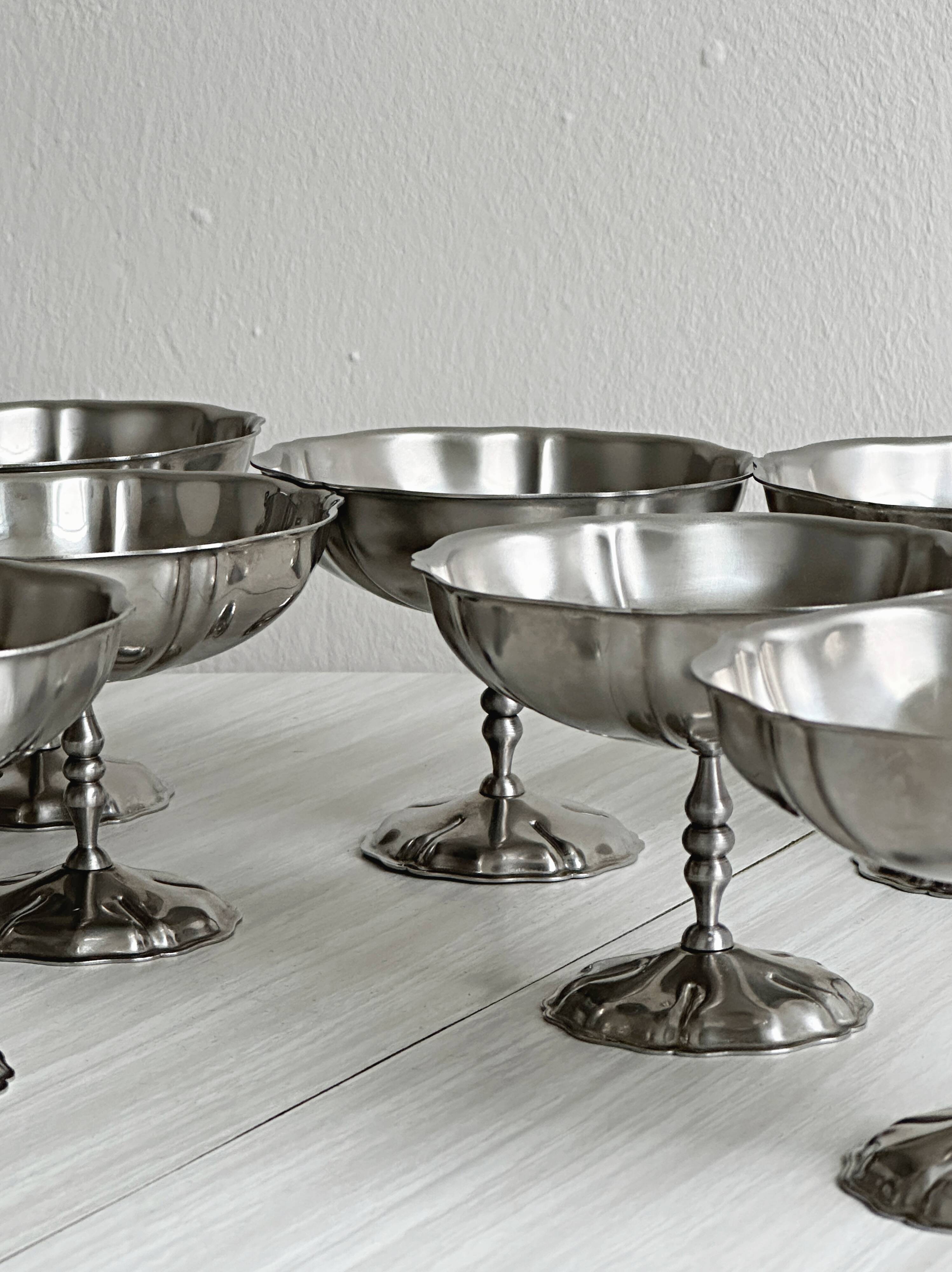 8 very large stainless steel footed bowls