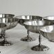 8 very large stainless steel footed bowls