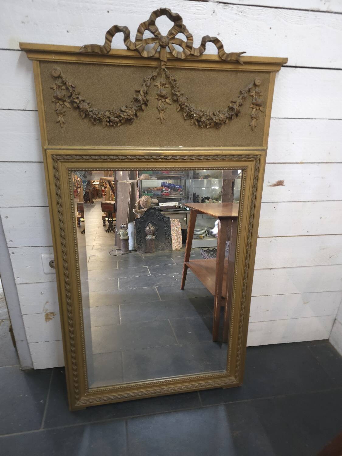 Gilded patinated trumeau mirror