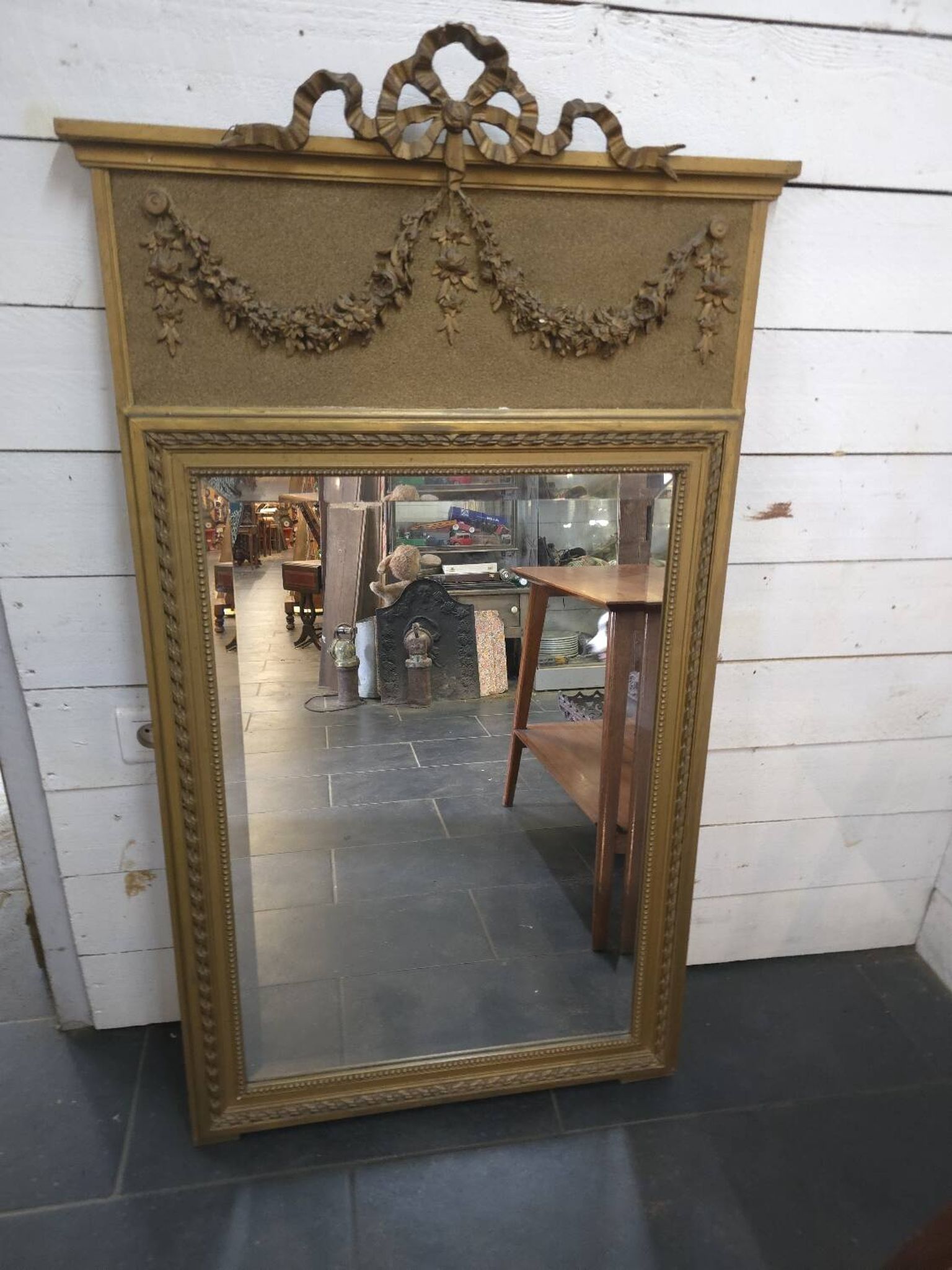Gilded patinated trumeau mirror