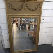 Gilded patinated trumeau mirror