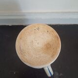 Old earthenware pourer with blue edging decoration