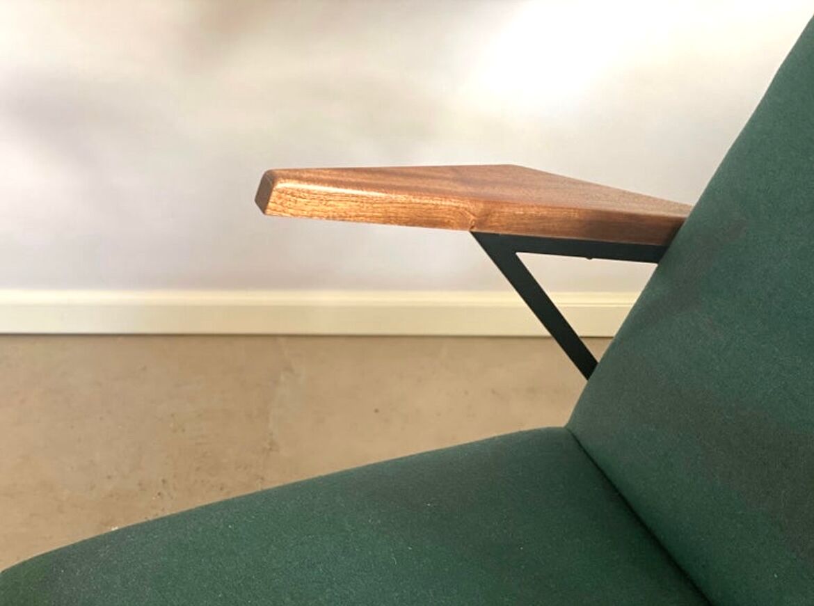 Lounge or easy chair with armrests